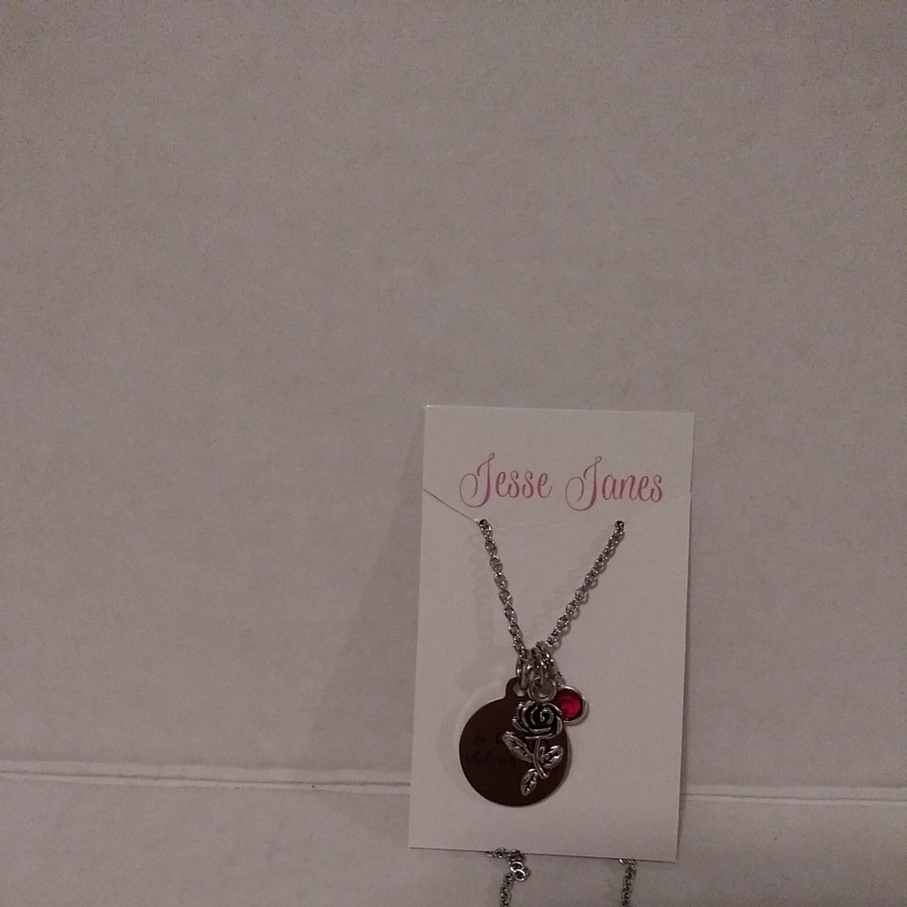 Jesse James Silver tone necklace with 3 charm rose Redstone and circle new. Chai